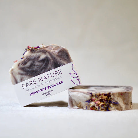 Bare Nature's Meadow's Edge Bar Soap is inspired by the feeling of walking barefoot in an alpine meadow. The soap has a deep, woodsy, floral scent and offers a rich and creamy lather that leaves your skin feeling nourished and clean.