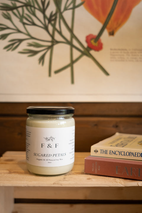 Expertly crafted with a blend of grapefruit, ylang ylang, orange, and vanilla essential oils, our Sugared Petals Soy Candle creates a soothing ambiance as well as an uplifting mood. Enjoy the subtle floral scent while indulging in a calm and relaxing atmosphere.