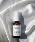 Our Aurora Perfume is luminous and a scent inspired by light in motion. Sparkling notes of citrus shimmer at the surface, with delicate rose and fruity davana at the heart. As it settles, smooth sandalwood and cedarwood create a grounding depth, softened by a veil of creamy vanilla. The result is an elegant, ever-evolving fragrance that is fresh, radiant, and quietly mesmerizing.