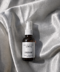 Dream is a calming, herbaceous home + body mist is crafted to guide you into a deeper, more intuitive state. Calming and softly herbaceous, this blend helps quiet mental chatter while encouraging vivid dreams, relaxation, and heightened awareness. Both grounding and gently uplifting, it creates a peaceful atmosphere that supports reflection, intuition and imagination.