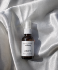 Drift is a calming home + body mist that's been created to help you drift off the sleep with ease. Soft, warm, and gently floral, its aroma settles around you like a slow exhale, encouraging relaxation and stillness before bed. Peaceful and comforting without feeling heavy, Drift is made for evenings when you want to slow down, let go, and gently drift into sleep.