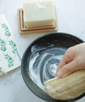 Our eco sponges are another great swap for your kitchen. These sponges feel and function like traditional sponges but are completely plant-based, plastic-free and compostable. The white part is spongy and absorbent, made of wood pulp while the yellow-brown part is scrubby and helps soap become sudsy, made of natural loofah.