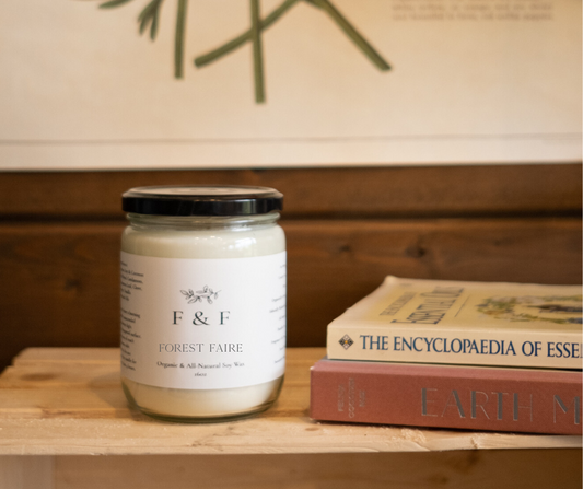 Indulge in the aroma of nature with our Forest Faire soy wax candle. Crafted with cedarwood, orange, frankincense, douglas fir, and balsam fir essential oils, this candle offers a refreshing and calming scent.