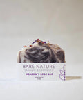 Bare Nature's Meadow's Edge Bar Soap is inspired by the feeling of walking barefoot in an alpine meadow. The soap has a deep, woodsy, floral scent and offers a rich and creamy lather that leaves your skin feeling nourished and clean.