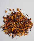 Orchard Sunset is a naturally caffeine-free fruit and herbal tea bursting with bright citrus and orchard fruit flavours. A vibrant blend of apple, hibiscus, rosehips, and orange peel creates a refreshing balance of sweet and tart with a beautiful ruby-red infusion. Delicious as a cozy hot cup of tea, or poured over ice for a crisp & refreshing beverage!