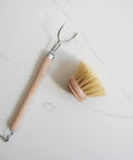 This Dish Brush 1.5" by Redecker is made with untreated beechwood and tampico plant fibres. This brush is strong and firm, making it perfect for cleaning all pots and pans.