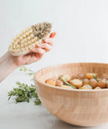 This vegetable brush provides a soft and hard side of bristles, making it ideal for cleaning everything from root vegetables to tomatoes and berries.