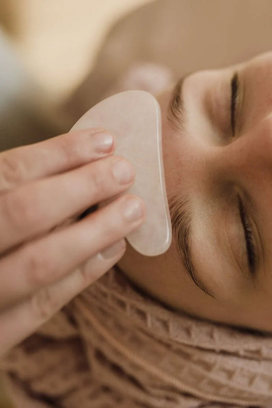Gua sha is a modality of traditional Chinese medicine that uses a stone tool that runs over the skin to break up tension due to stagnation from water retention, muscle tightness, or other congestion.