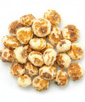Peeled tiger nuts are small, naturally sweet tubers from the Cyperus esculentus, with the outer skin removed for a smoother texture and easier snacking. They have a mildly nutty, coconut-like flavour and are rich in fiber, healthy fats, and key minerals like magnesium and potassium.